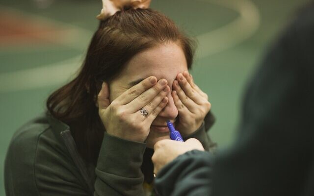 Lilli Jennison tries to guess the type of marker by smelling its scent // Photo Credit: Jason Belsky