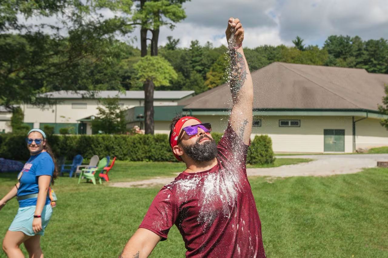 Staff member Harris Fox represented team Red Foxes during a "color war" challenge at Camp Eisner. JAY BELSKY