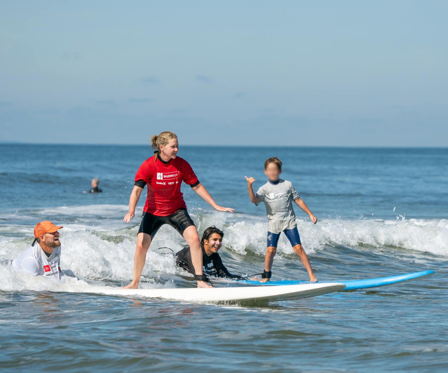 Amy Schumer and Son Gene with Professional Big Wave Surfer Will Skudin and Surf Instructor Ryder