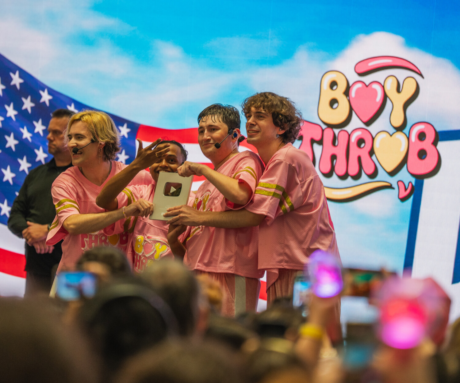 BoyThrob accepting their 100k YouTube plaque on stage