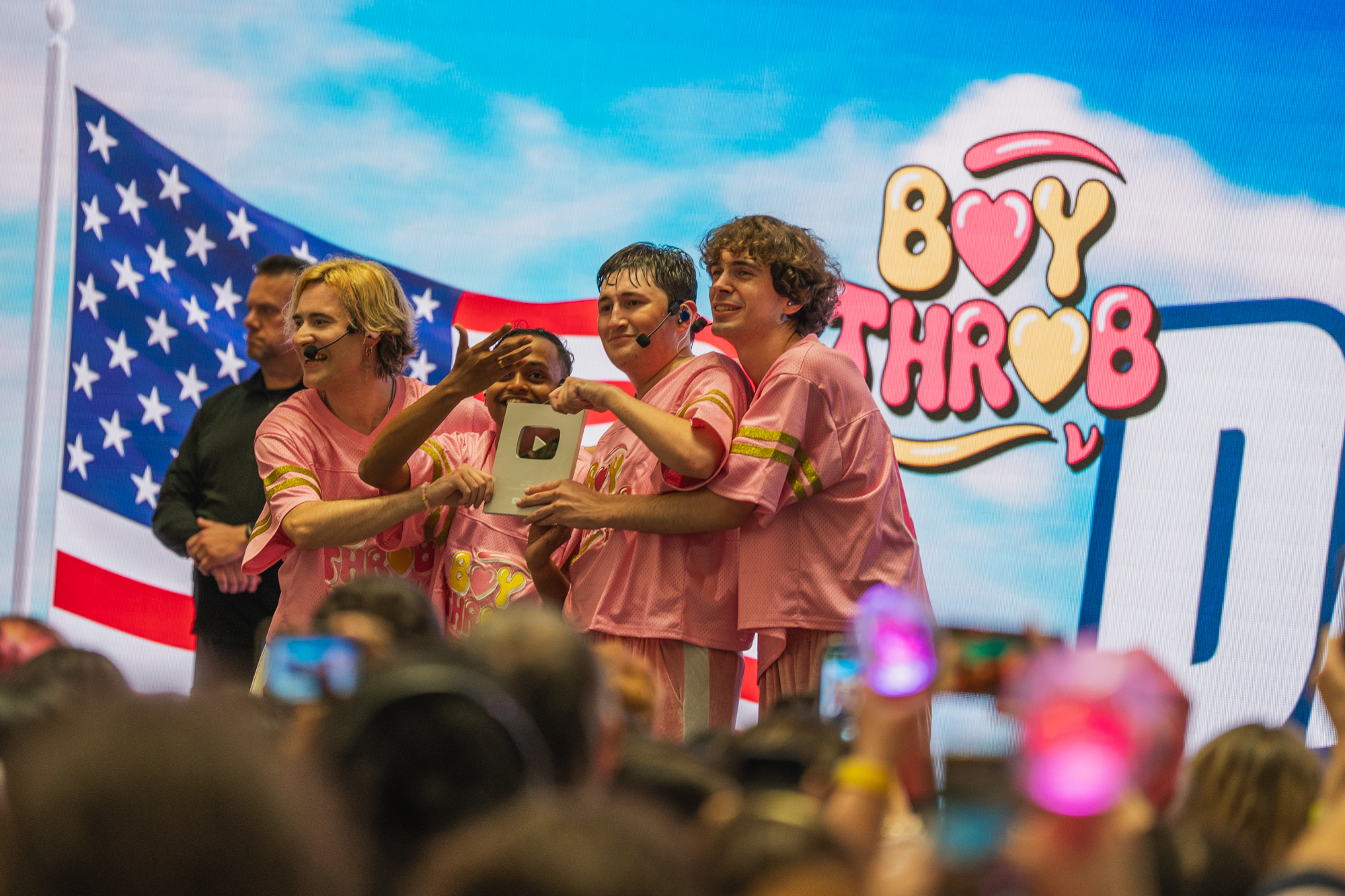 BoyThrob accepting their 100k YouTube plaque on stage